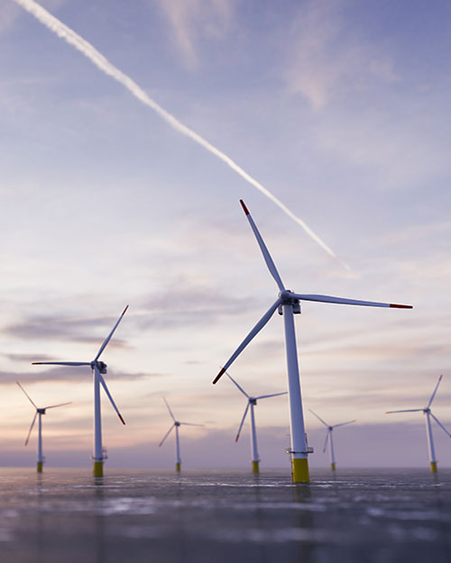 parque eólico marino al atardecer